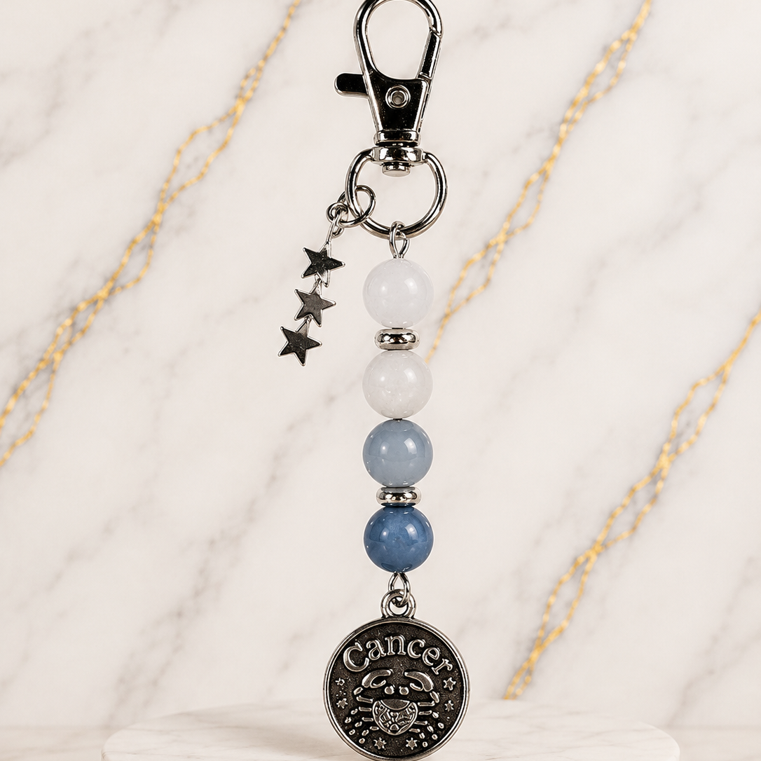 Keychain with beads and star charm on a marble base