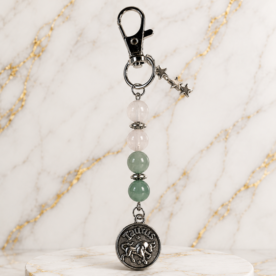 Keychain with beads and a star charm on a marble background