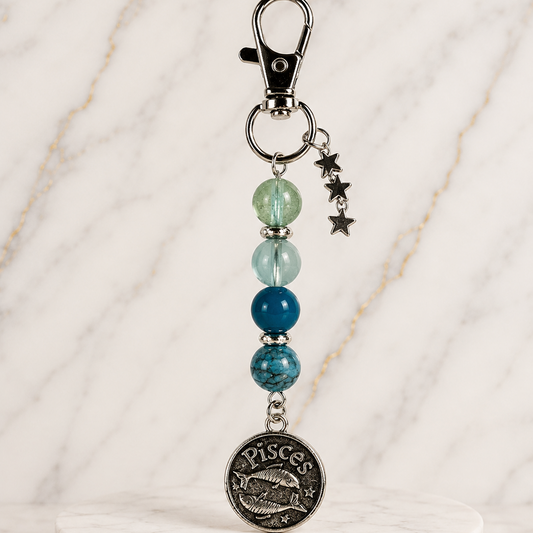 Keychain with beads and Pisces pendant on a white background