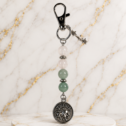 Keychain with beads and a star charm on a marble background